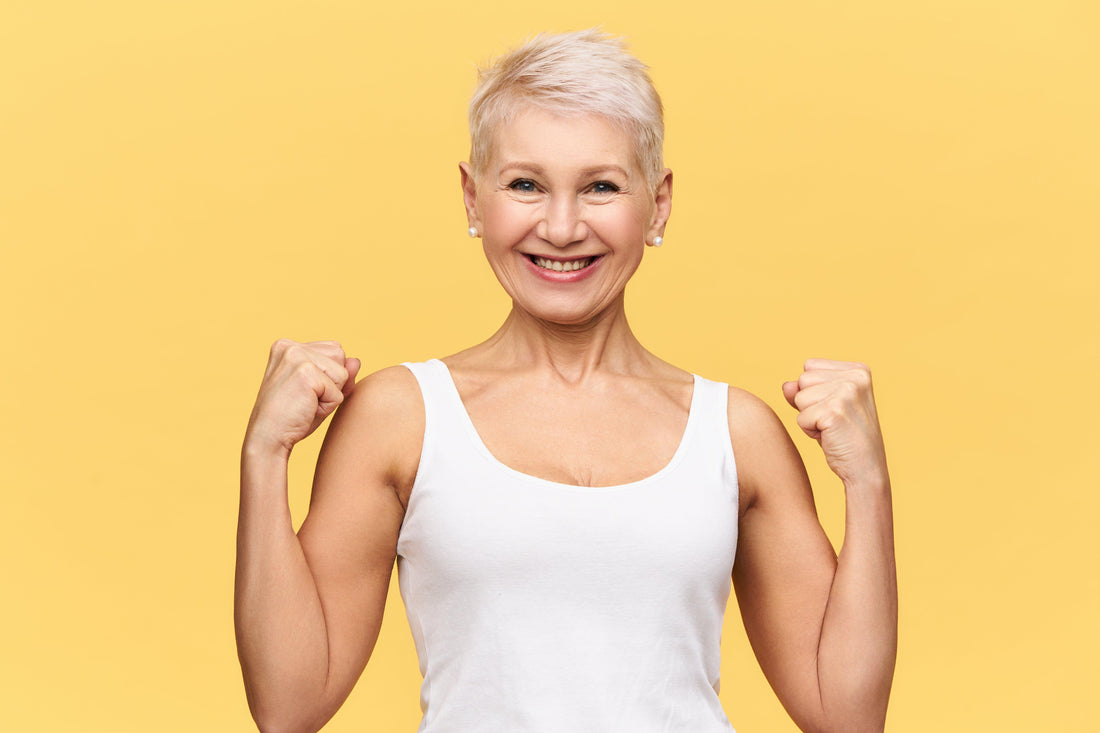 Illustration of a person with a strong and healthy immune system, depicted as glowing with vitality and surrounded by protective white blood cells.