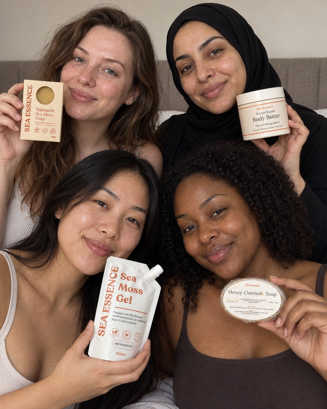 Four women holding the Turmeric Soap, Body Butter, Sea Moss Gel and Honey Oatmeal Soap